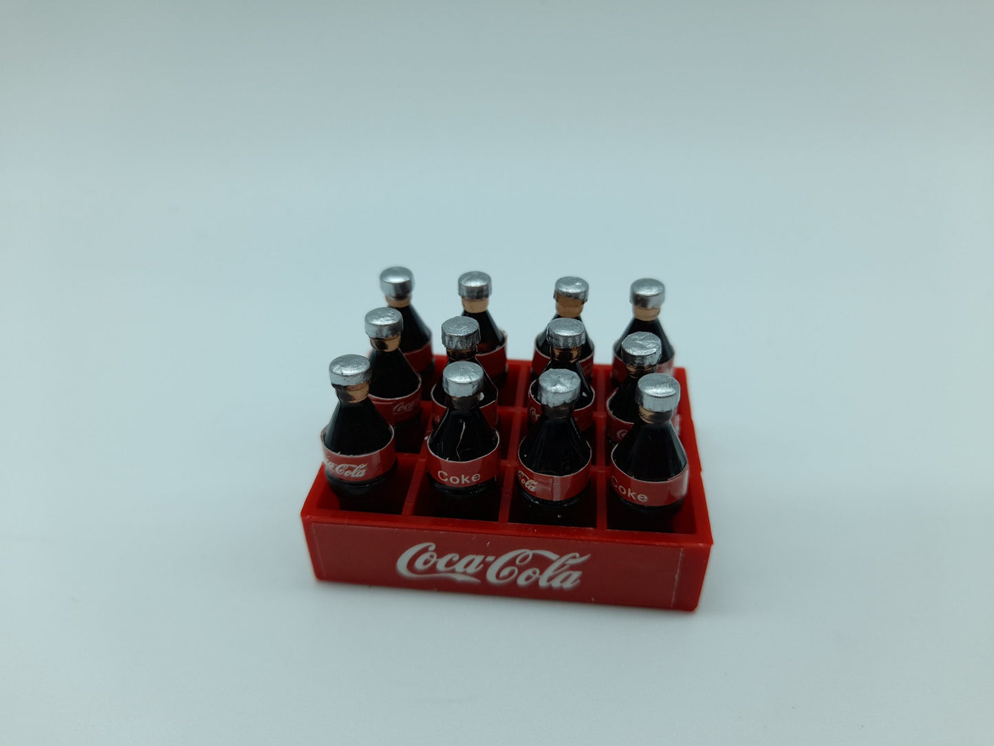Set of (12) soft drink bottles with ice cubes
