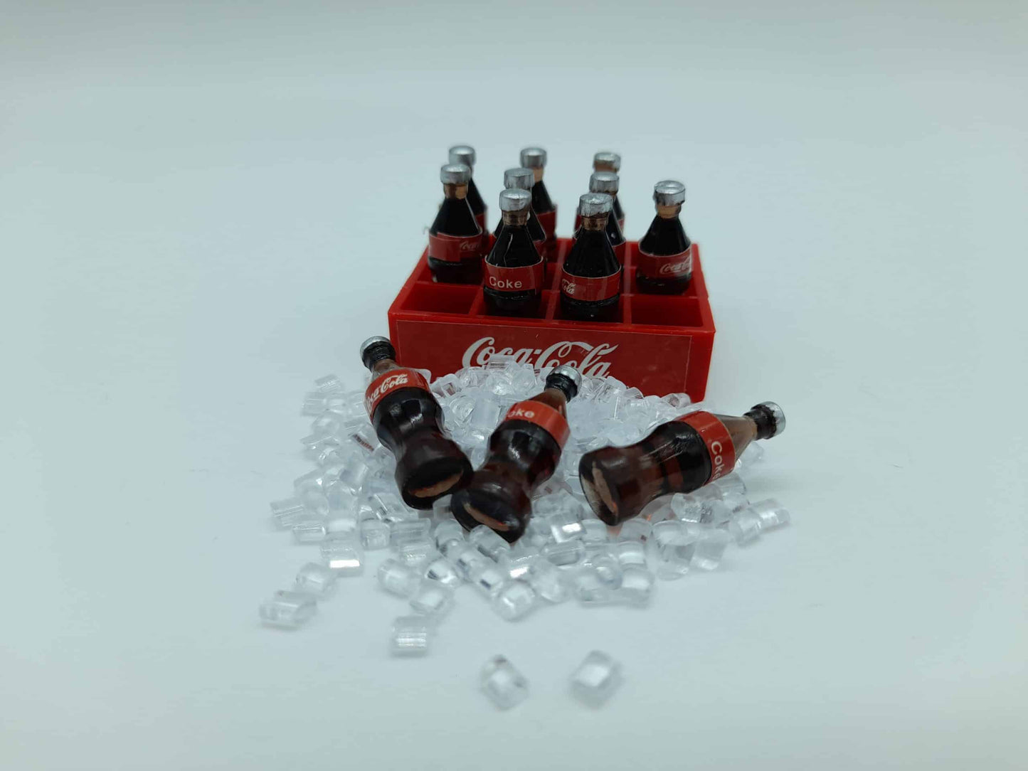 Set of (12) soft drink bottles with ice cubes