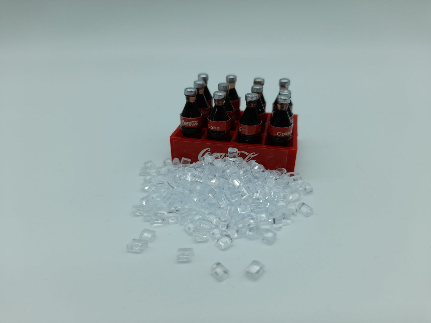 Set of (12) soft drink bottles with ice cubes